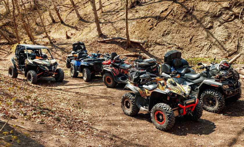 Bunch of ATVs on a dirt road
